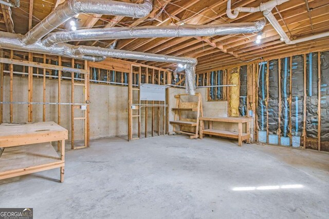 bathroom featuring a paneled ceiling, a tile shower, hardwood / wood-style flooring, vanity, and toilet