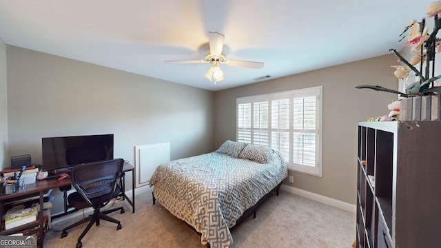 carpeted bedroom with ceiling fan