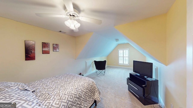 carpeted bedroom featuring lofted ceiling and ceiling fan