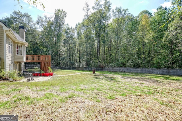 view of yard featuring a deck