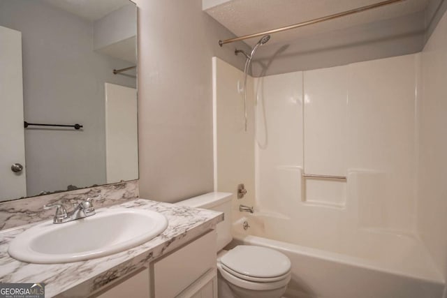 full bathroom with vanity, washtub / shower combination, and toilet