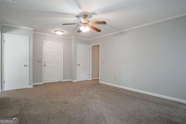 unfurnished bedroom featuring ceiling fan, ornamental molding, and carpet flooring