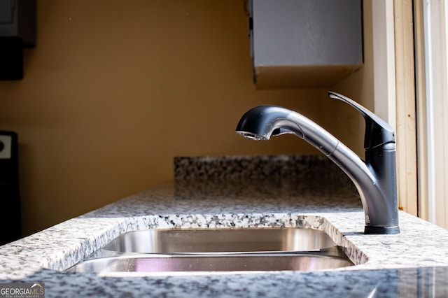 interior details with light stone counters and sink