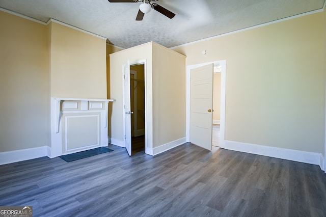 unfurnished bedroom with crown molding, dark hardwood / wood-style floors, and ceiling fan