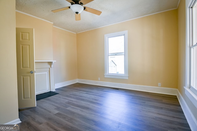 unfurnished living room with ceiling fan, dark wood-type flooring, ornamental molding, and a textured ceiling