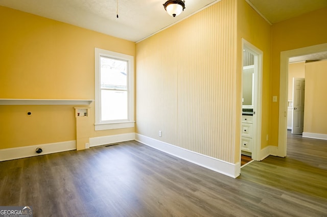 unfurnished room featuring wood-type flooring