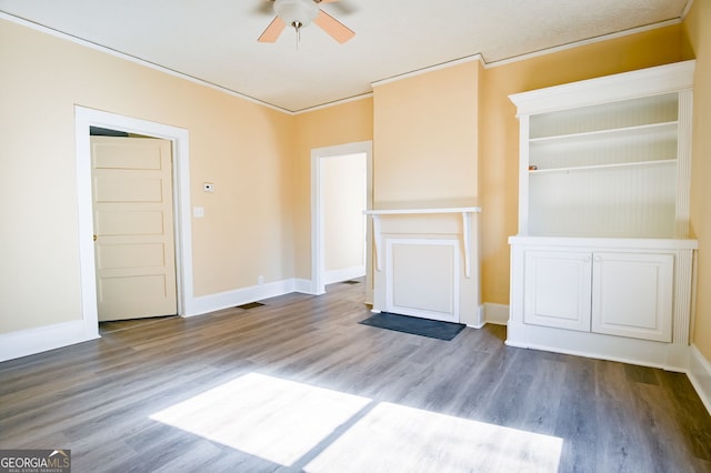 unfurnished living room with ceiling fan, ornamental molding, and wood-type flooring