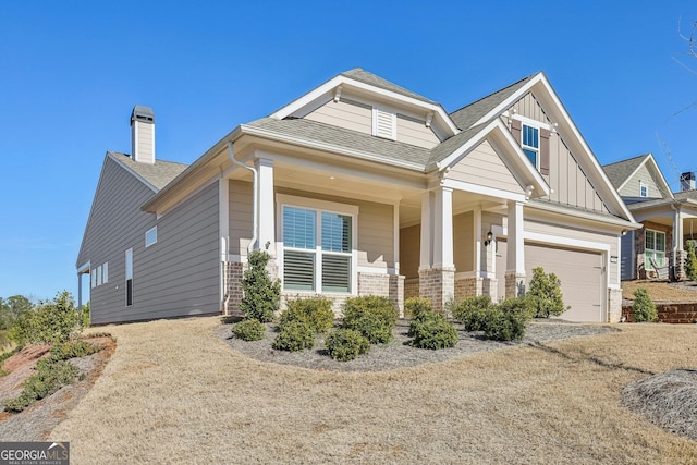 craftsman house with a garage and a porch