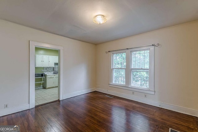 empty room featuring wood-type flooring