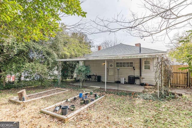 back of property featuring a patio