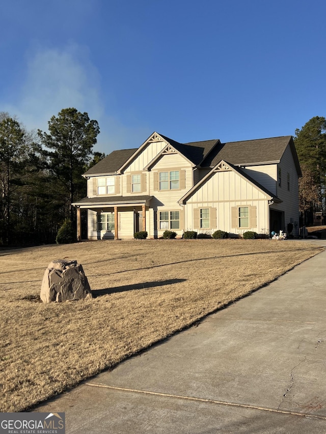 view of front of home with a front lawn and covered porch