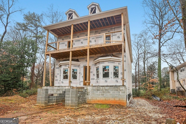 back of house with a balcony