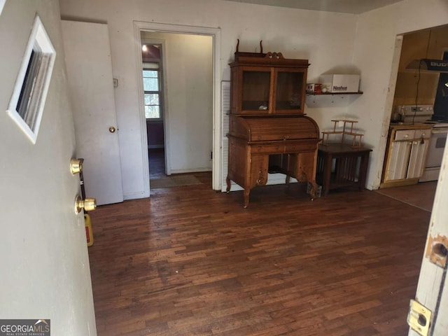 dining space with dark hardwood / wood-style floors