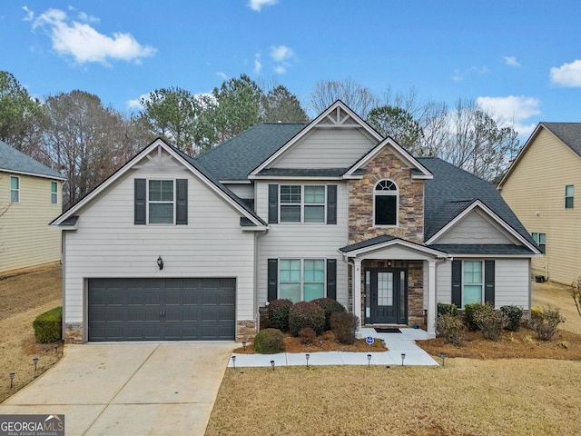 view of front of home with a garage and a front yard