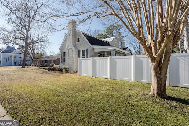 view of property exterior featuring a lawn