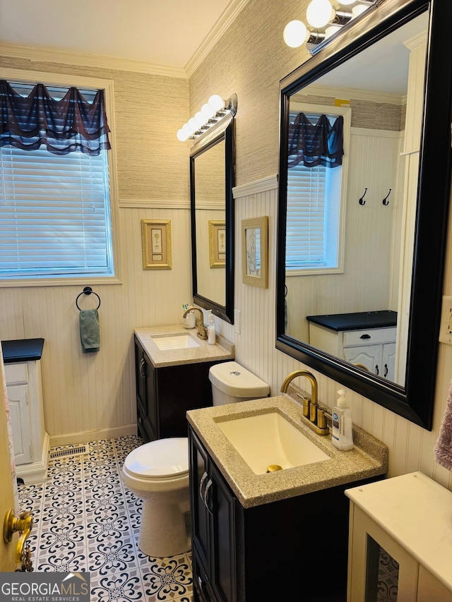 bathroom with crown molding, tile patterned floors, vanity, and toilet