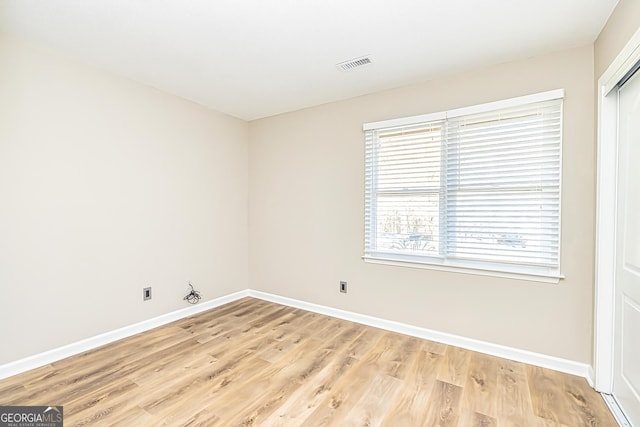 spare room with light wood-type flooring