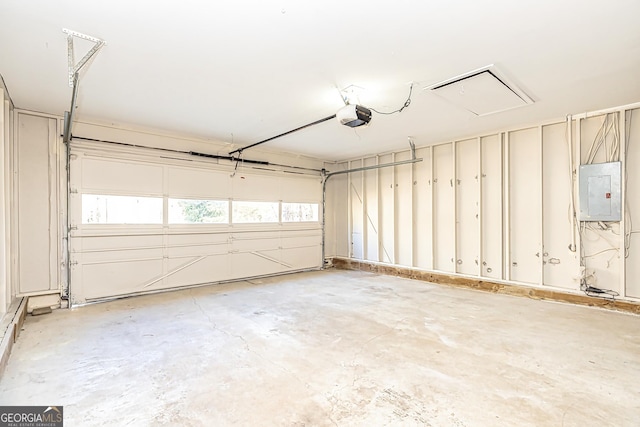 garage featuring a garage door opener and electric panel