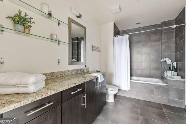 full bathroom featuring shower / bath combination with curtain, vanity, toilet, and tile patterned flooring