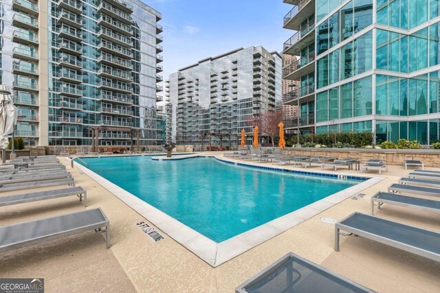 view of pool featuring a patio area