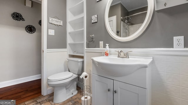 bathroom with vanity, wood-type flooring, and toilet