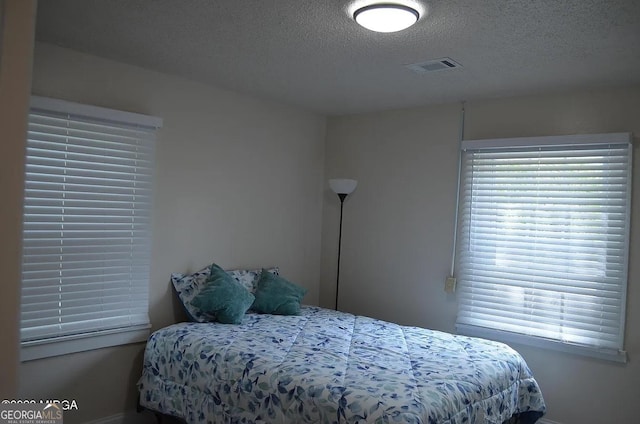 bedroom with a textured ceiling