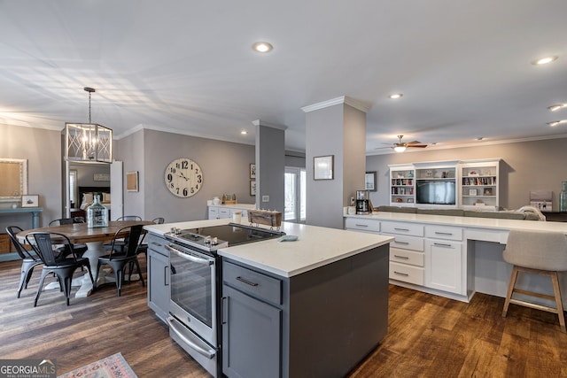 kitchen with white cabinetry, decorative light fixtures, electric range, ornamental molding, and dark hardwood / wood-style flooring