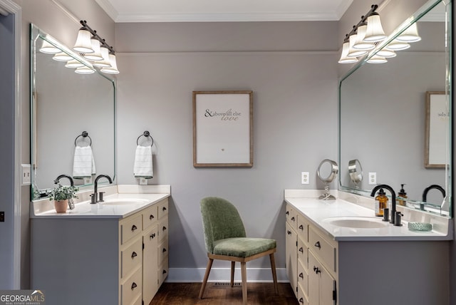 bathroom featuring vanity, hardwood / wood-style flooring, and ornamental molding