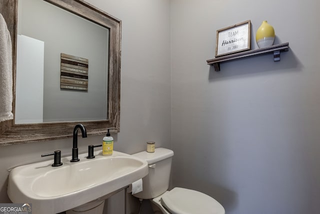 bathroom featuring sink and toilet