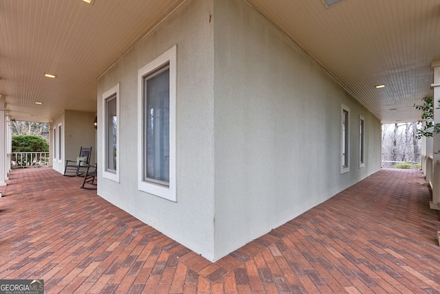 view of property exterior with covered porch