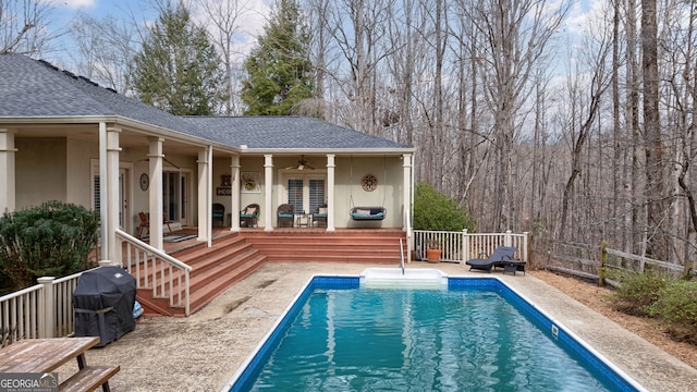 view of pool featuring area for grilling, a patio area, ceiling fan, and a deck