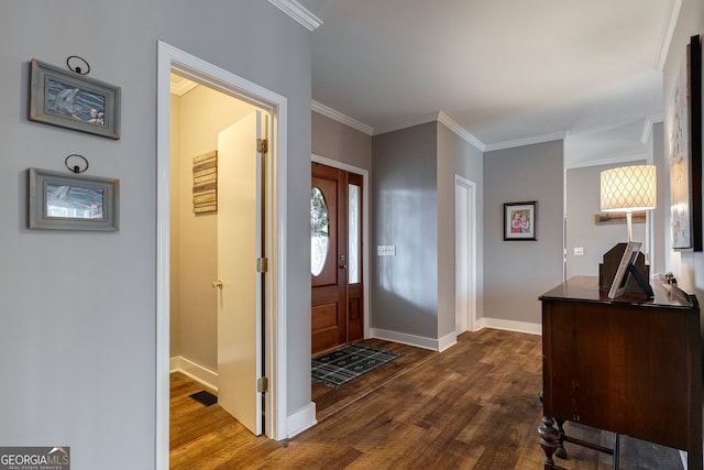 entrance foyer with dark wood-type flooring and ornamental molding