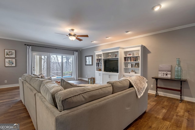 living room with ceiling fan, ornamental molding, and dark hardwood / wood-style flooring