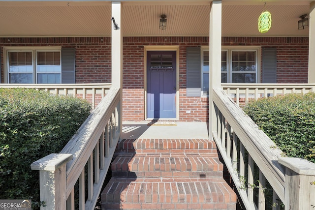 doorway to property with covered porch