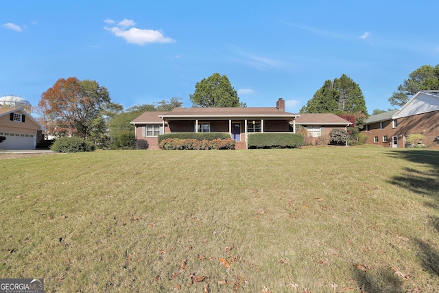 ranch-style house featuring a front yard