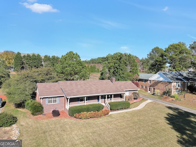 view of front of home featuring a front lawn and covered porch