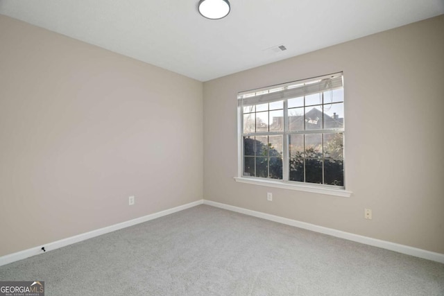 unfurnished room with carpet flooring