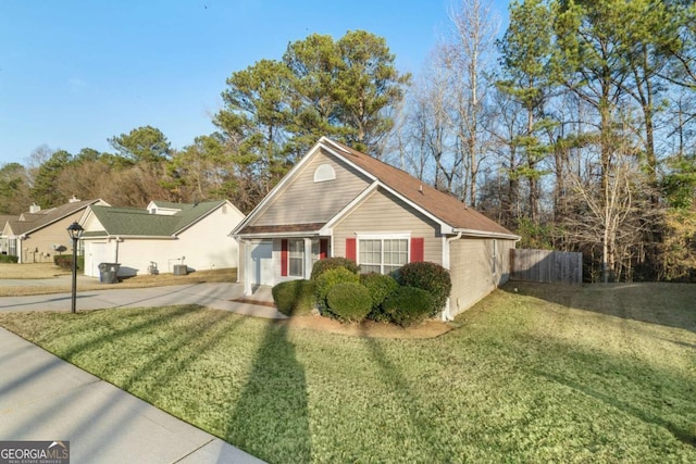 view of front of house with a garage and a front yard