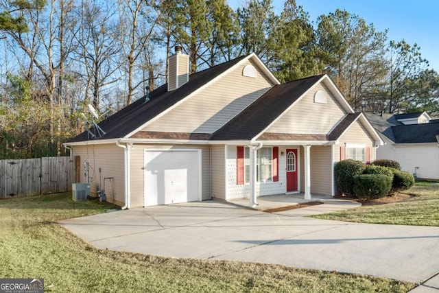 view of front of home with a garage and a front yard