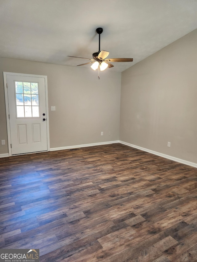 empty room featuring dark hardwood / wood-style floors and ceiling fan