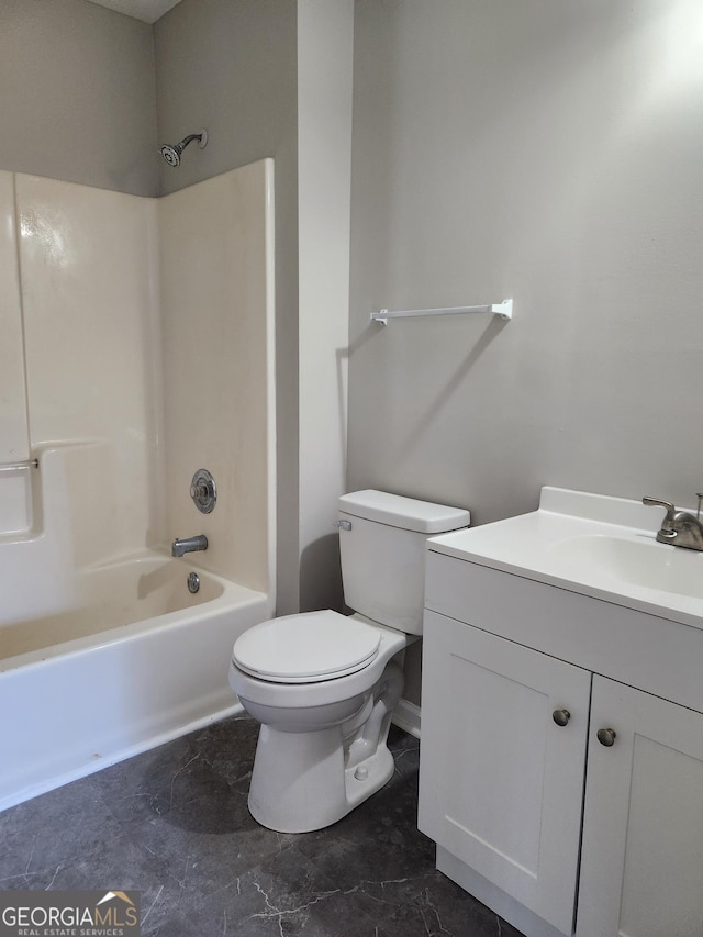 full bathroom featuring vanity, bathing tub / shower combination, and toilet