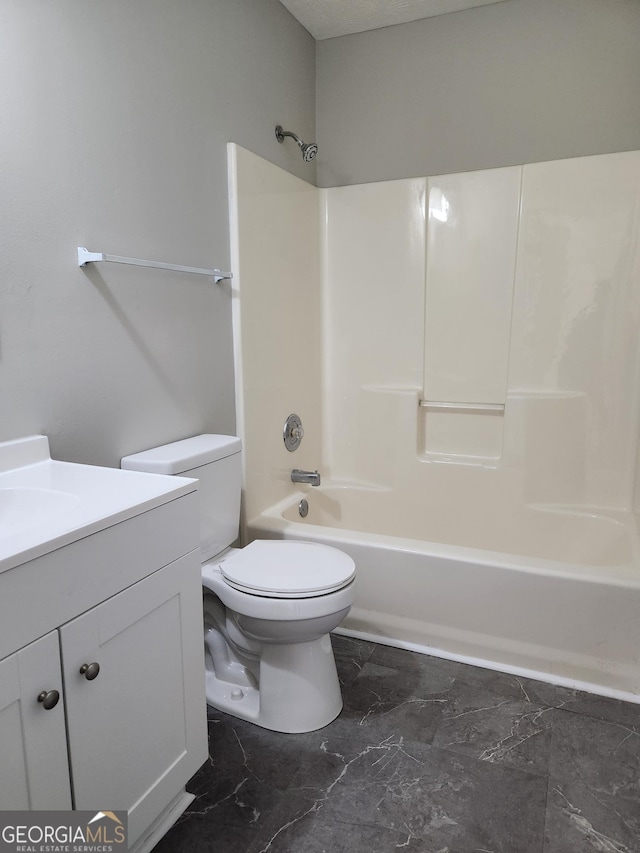 full bathroom with vanity,  shower combination, and toilet