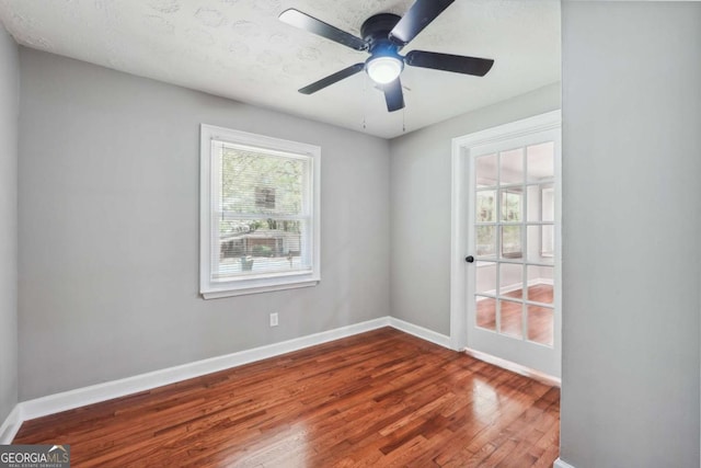 unfurnished room with wood-type flooring and ceiling fan