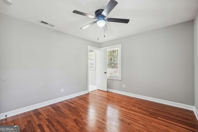 empty room featuring hardwood / wood-style floors and ceiling fan