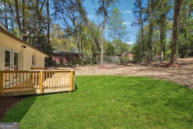 view of yard featuring a wooden deck