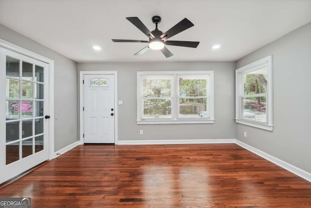 entrance foyer featuring dark hardwood / wood-style flooring and ceiling fan