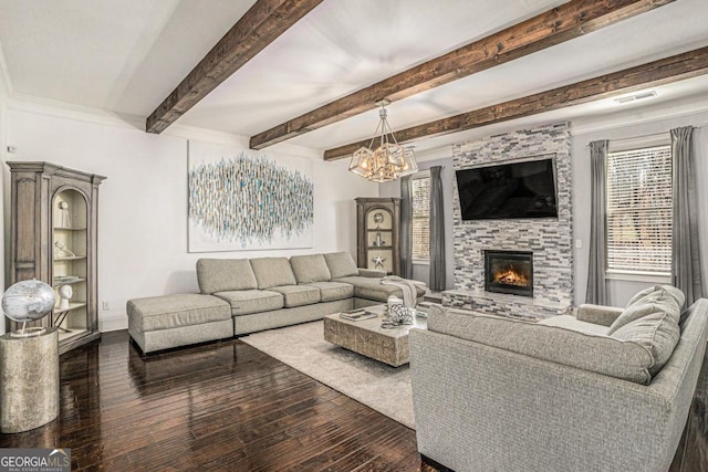 living room with beam ceiling, dark hardwood / wood-style floors, a notable chandelier, and a fireplace