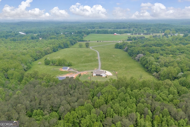 birds eye view of property with a rural view and a forest view