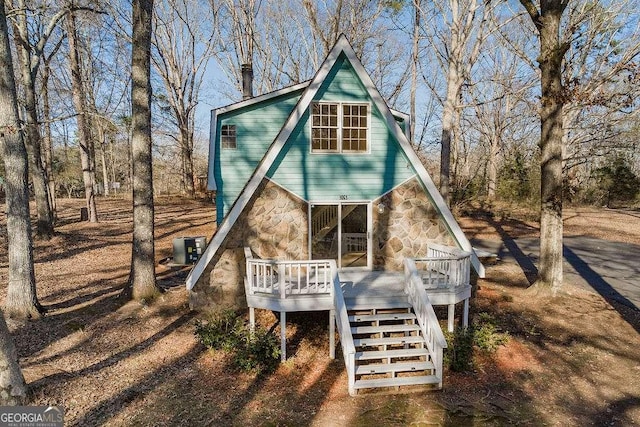 exterior space featuring a wooden deck