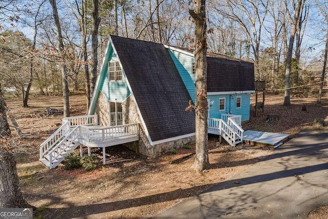 view of front of property featuring a wooden deck